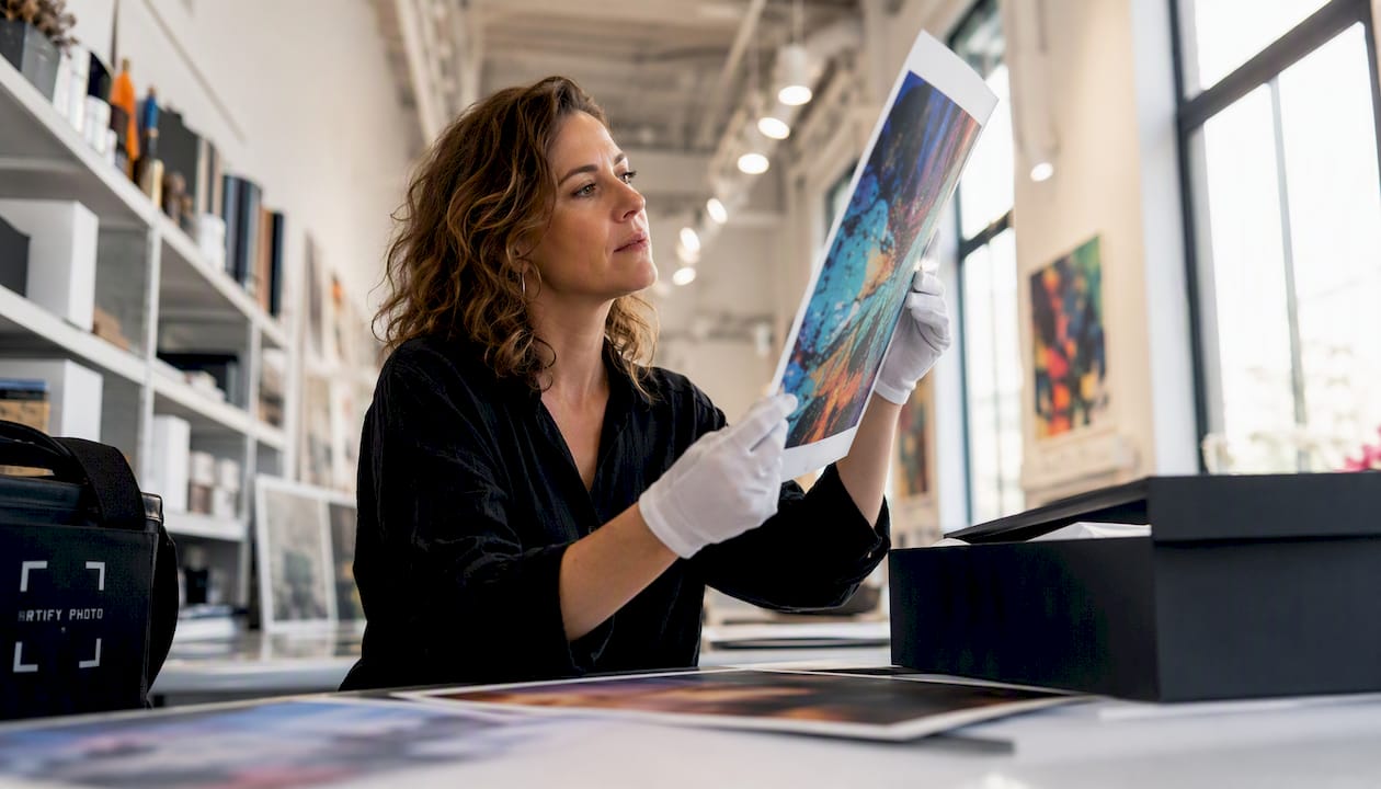 Artist inspecting gallery-quality art print